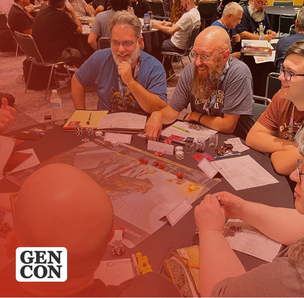 Players seated around a table demoing a tabletop game at GenCon