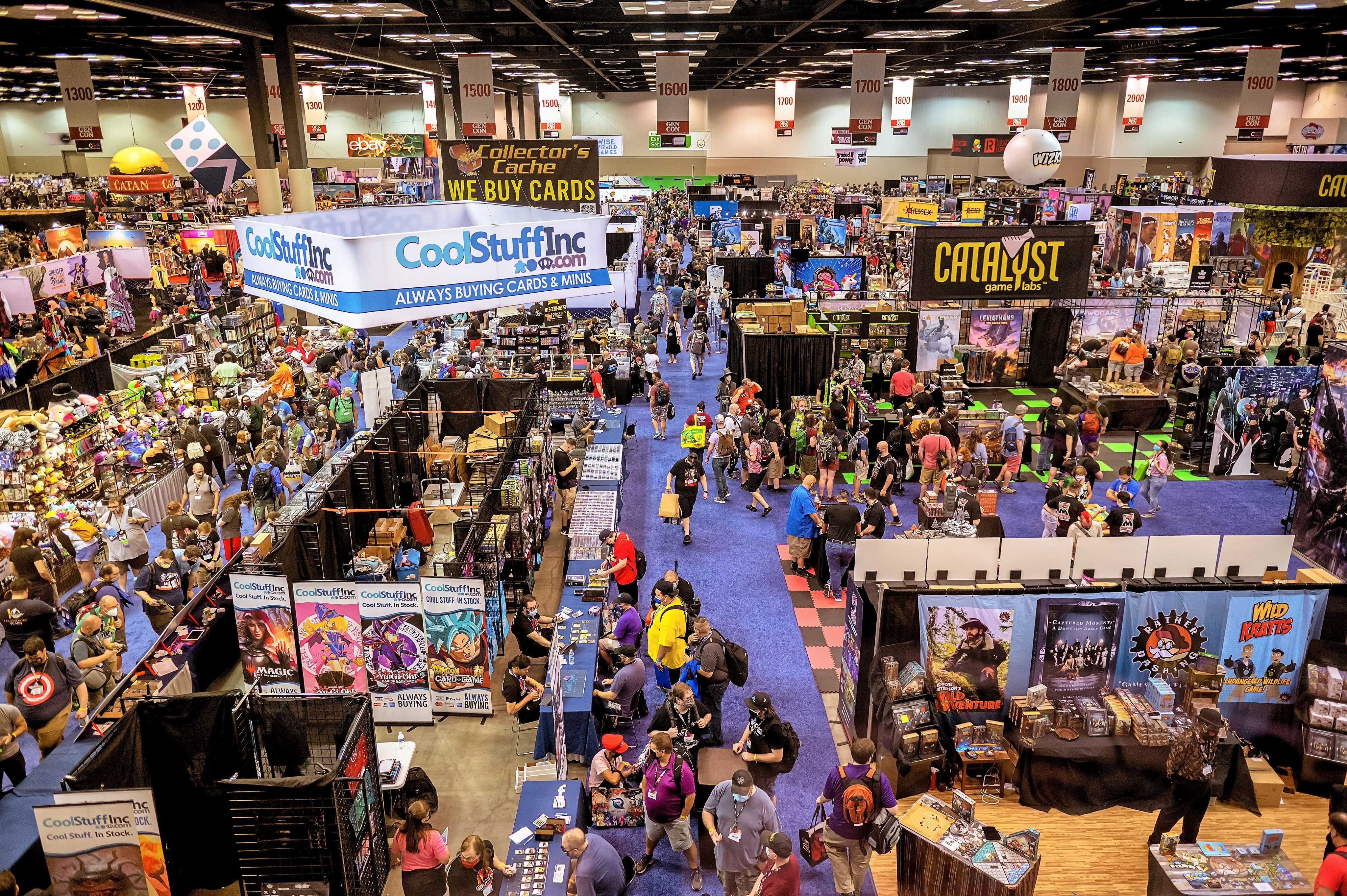 Attendees browsing the show floor at GenCon